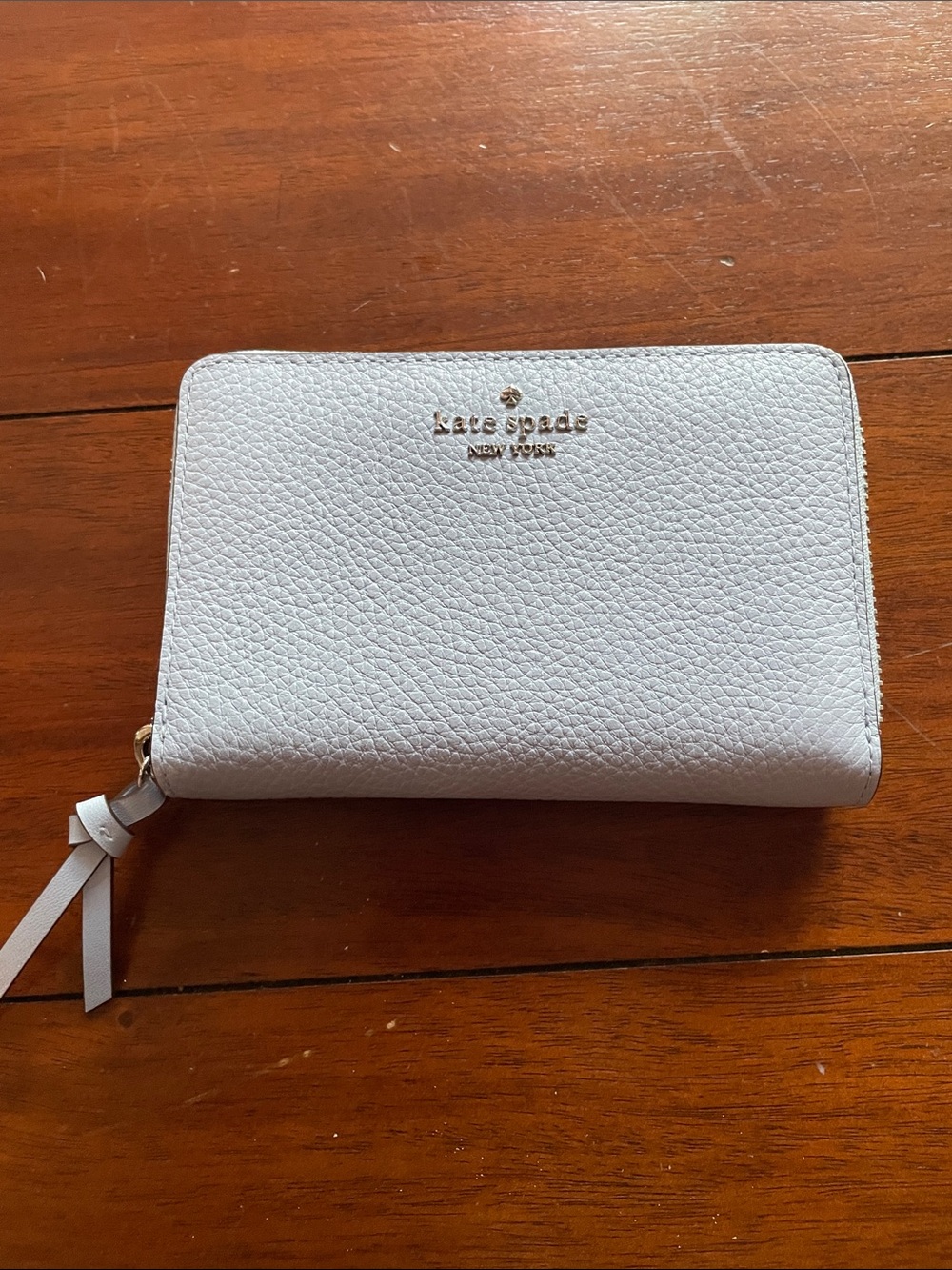 NWOT KATE SPADE Light blue color Pebbled Zip-Around Wallet with Gold Logo